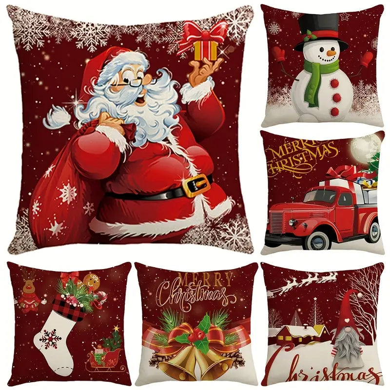 Six red Christmas cushion covers printed with Santa, a snowman and a red truck