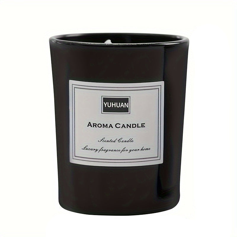 Black glass candle jar with a white printed label