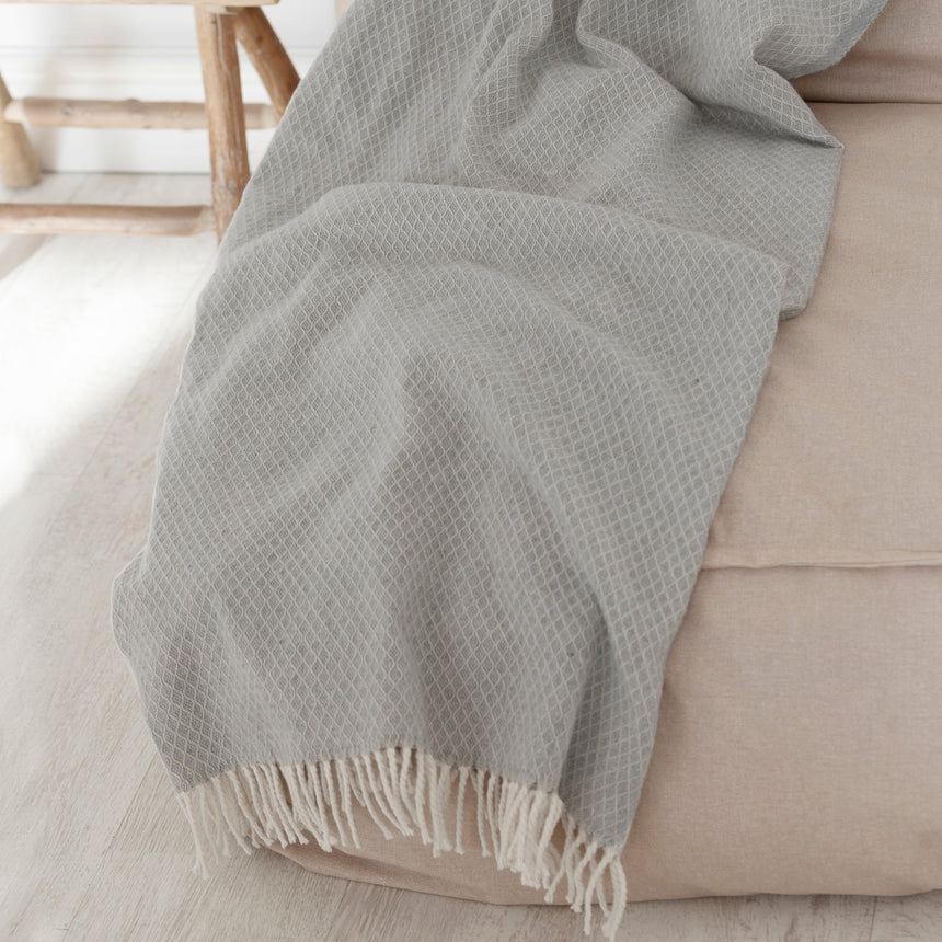 Grey Coast throw with a fringed edge