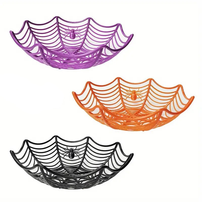 Three spider web plastic bowls in purple, orange and black