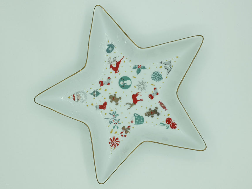 Star-shaped white porcelain tray printed with Christmas motifs