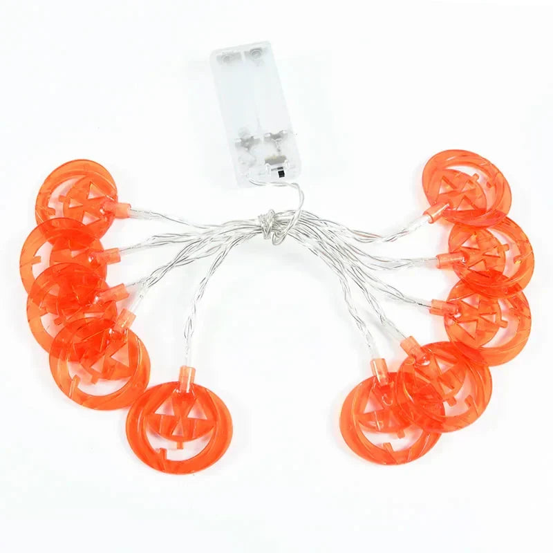 Orange pumpkin LED string lights with a battery box