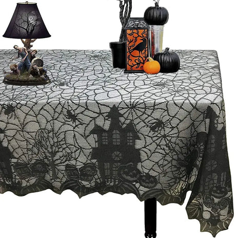 Black lace Halloween tablecloth with a haunted house design on a table