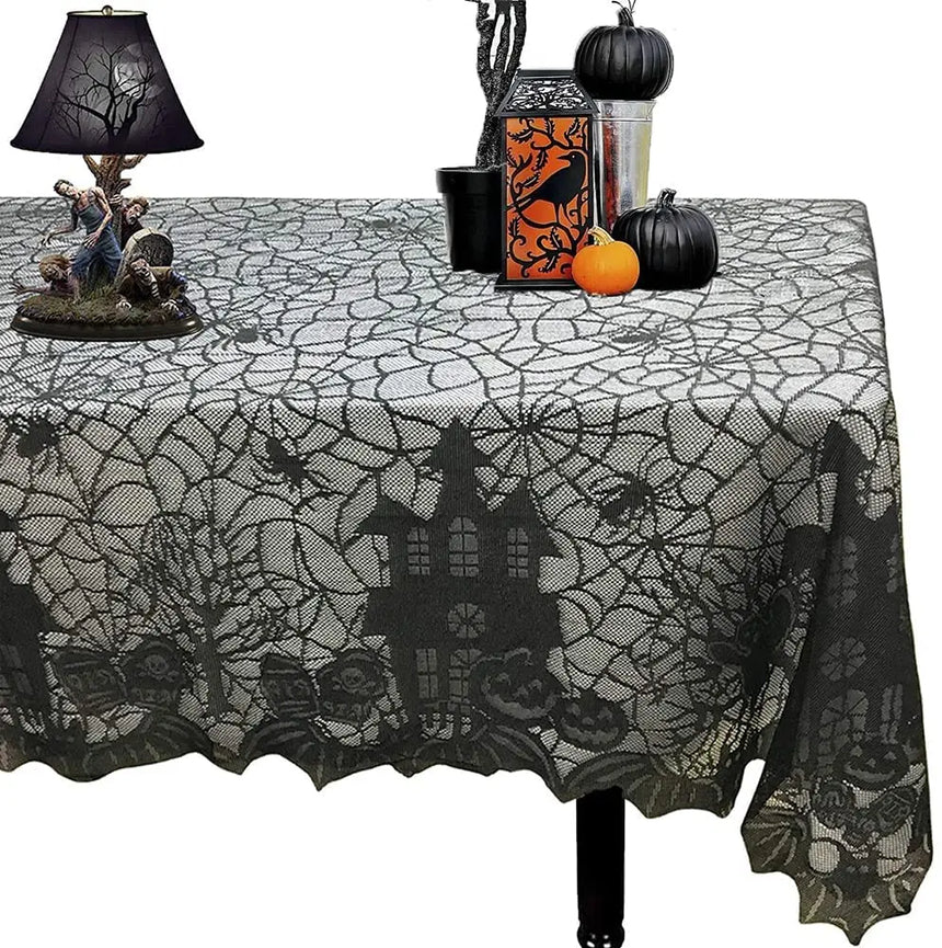 Black lace Halloween tablecloth with a haunted house design on a table