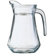 Clear glass water jug with a curved handle and faceted base
