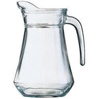 Clear glass water jug with a curved handle and faceted base