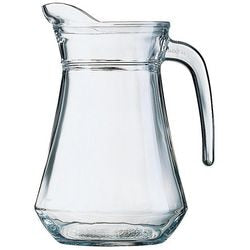 Clear glass water jug with a curved handle and faceted base