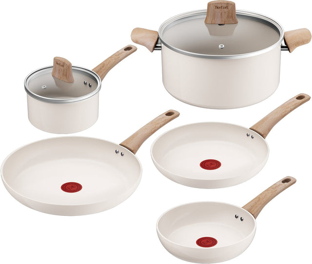 Five piece cream ceramic pan set with wood-effect handles and glass lids