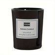 Black glass candle jar with a white printed label