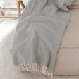 Grey Coast throw with a fringed edge
