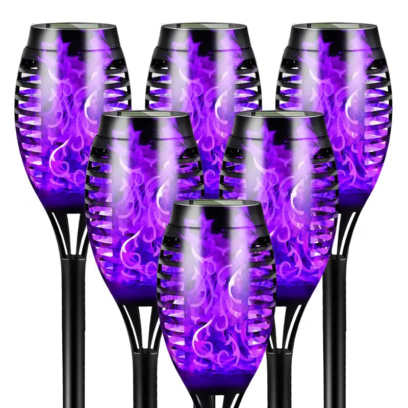 Six solar garden torches with a purple flame effect