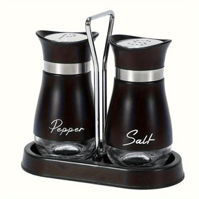 Black salt and pepper shakers on a black stand with a chrome handle