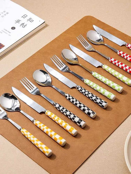 Six-piece stainless steel flatware set with checkered handles