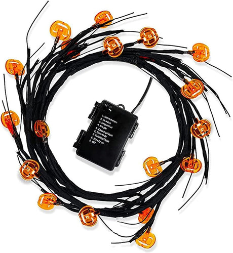 Willow branch light string with orange pumpkin LEDs and a battery box
