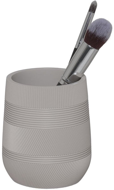 Free-standing toothbrush beaker in sand