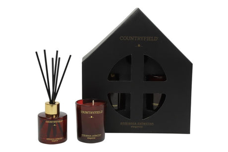 Gift box holding a fragrance stick set and a small candle