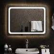 A rectangular bathroom mirror, wider than it is tall, lit around the edge by an integrated LED strip