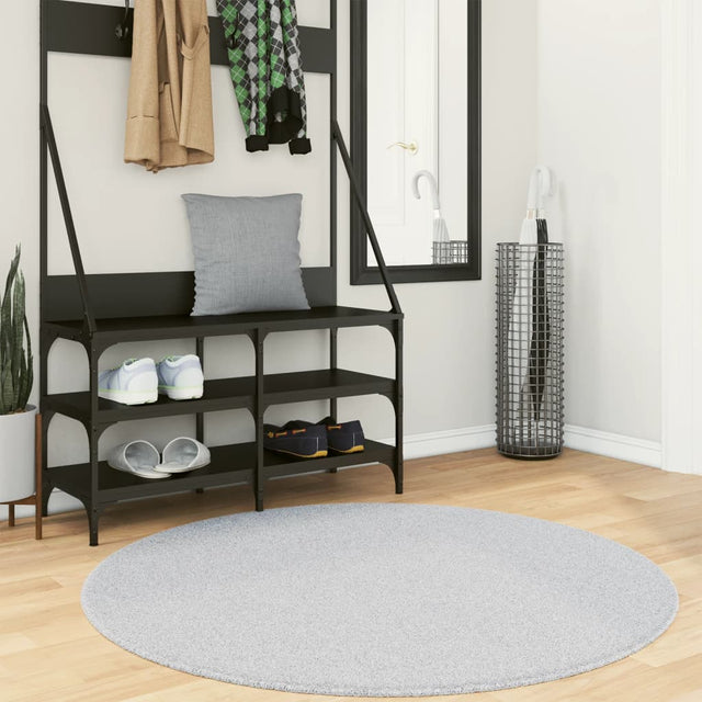Round gray short-pile rug