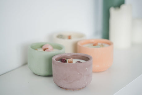 Hand-poured candle in a cement vessel