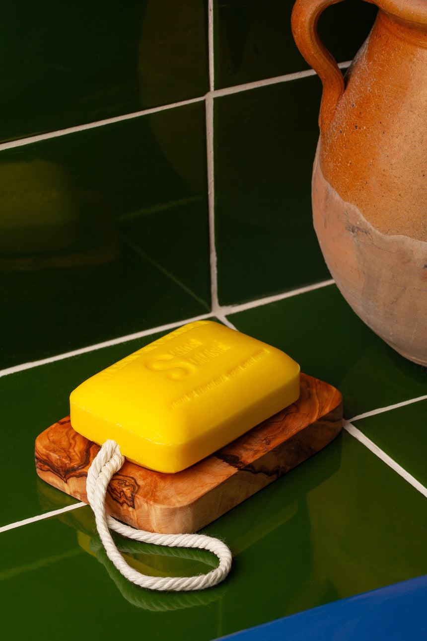 Olive wood soap dish cut from a single piece, showing natural grain
