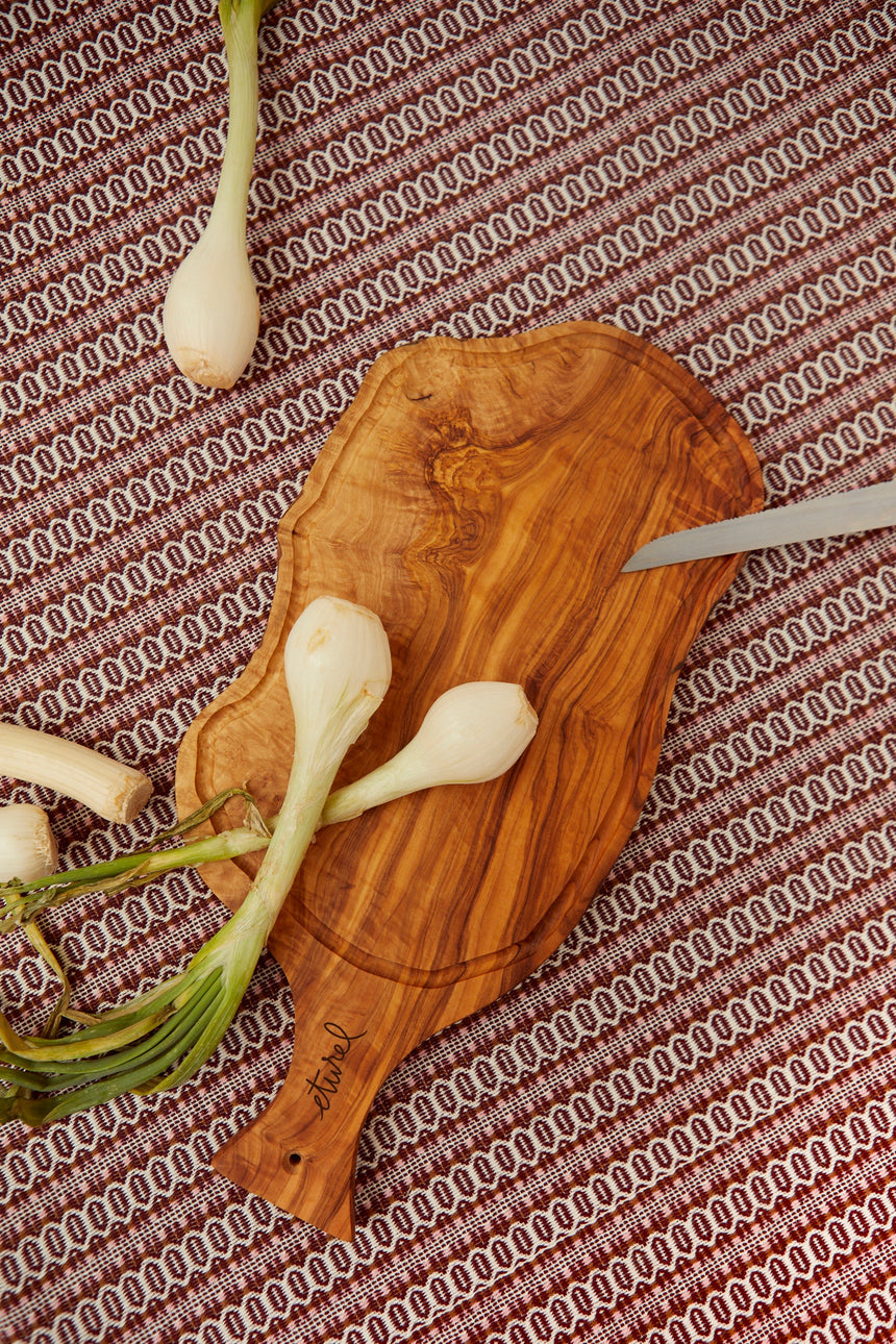 Olive wood chopping board with a carved handle