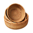 Three brown rattan storage baskets in three sizes