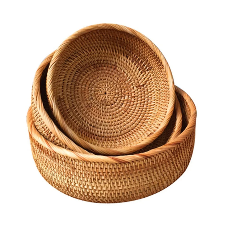 Three brown rattan storage baskets in three sizes