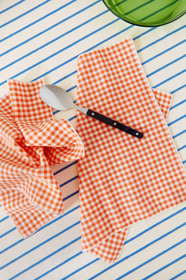 Two cotton napkins in a small orange vichy check