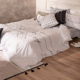 White duvet cover printed with live, love, laugh in script