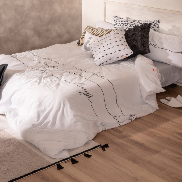 White duvet cover printed with live, love, laugh in script