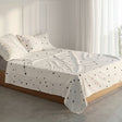 White flat sheet printed with small black stars and constellation lines
