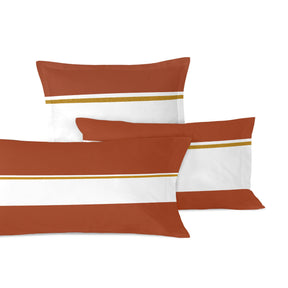 White pillowcase with wide brown bands and a thin gold stripe