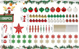 Red, green and white Christmas baubles, snowflakes and a red star laid out in rows