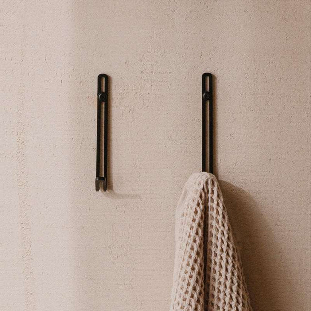Wall hook in stainless steel with a matte finish
