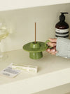 Green handmade ceramic UFO candle holder with a ring handle