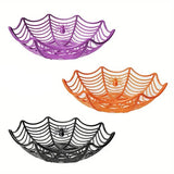 Three spider web plastic bowls in purple, orange and black