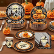 Halloween paper plates, cups and napkins with pumpkins and a haunted house