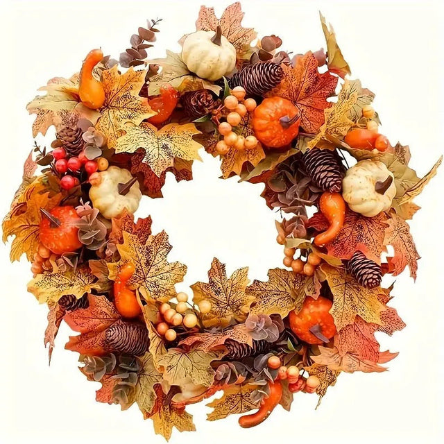 Autumn harvest wreath with pumpkins, maple leaves, berries and pine cones