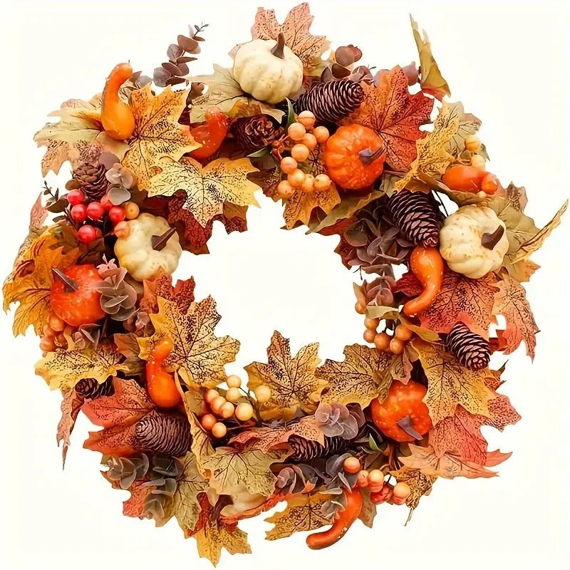 Autumn harvest wreath with pumpkins, maple leaves, berries and pine cones