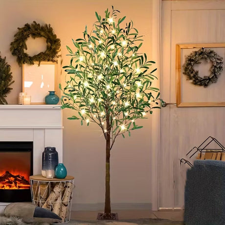 Artificial green tree lit with warm white LED lights