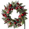 Green Christmas wreath with candy canes, red baubles and berries