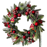 Green Christmas wreath with candy canes, red baubles and berries