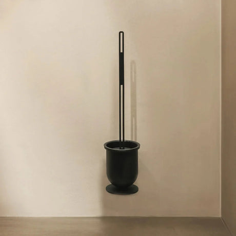 Stainless steel toilet brush holder with a removable inner container, shown free-standing