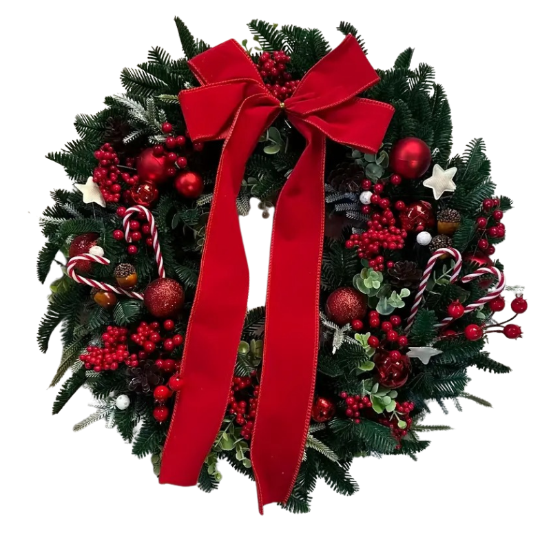 Green Christmas wreath with a large red bow, red berries and baubles