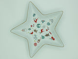 Star-shaped white porcelain tray printed with Christmas motifs