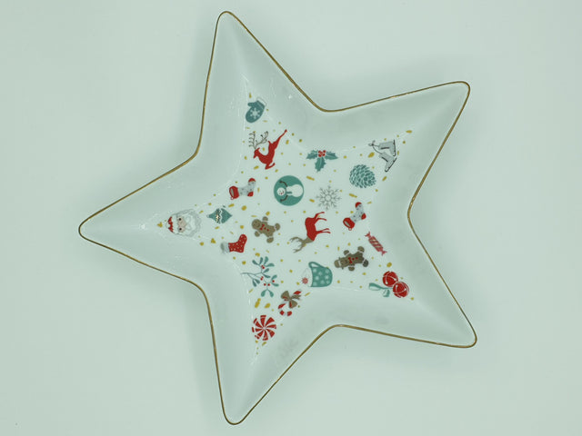 Star-shaped white porcelain tray printed with Christmas motifs